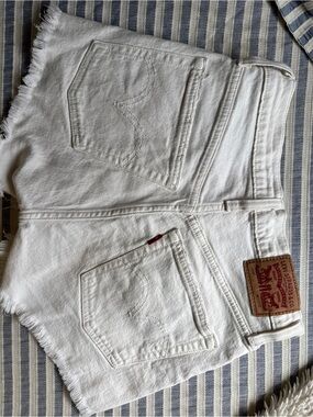 Levi's White Denim Cutoff Shorts with Frayed Hem